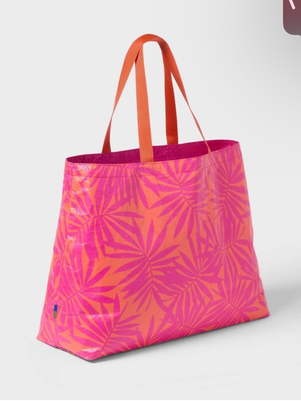 Water Resistant
Reversible Tote Bag from Open
Story Pink Coral Palm